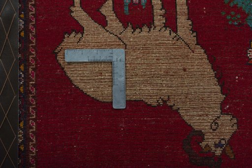Backside of handmade 2000s Shiraz rug showing knot structure and weave density