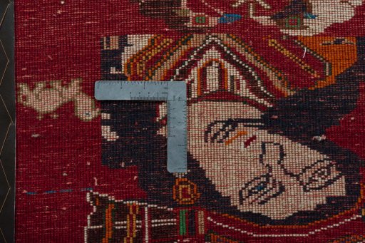 Backside of handmade 2000s Shiraz rug showing knot structure and weave density