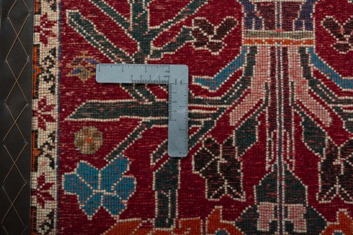 Backside of handmade 2000s Shiraz rug showing knot structure and weave density
