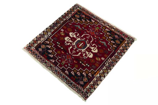 Corner detail of 2000s Shiraz rug showing border pattern and Wool pile