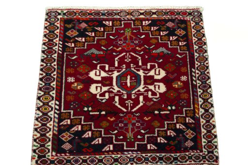 Surface texture of 2000s Shiraz rug with natural Wool and intricate pattern