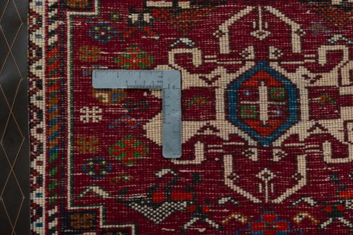 Backside of handmade 2000s Shiraz rug showing knot structure and weave density