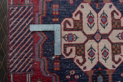 Backside of handmade 2000s Shiraz rug showing knot structure and weave density
