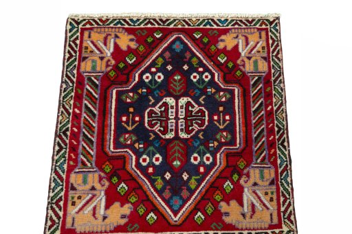 Surface texture of 2000s Shiraz rug with natural Wool and intricate pattern