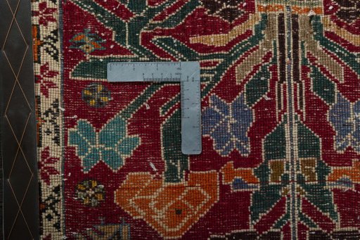 Backside of handmade 2000s Shiraz rug showing knot structure and weave density