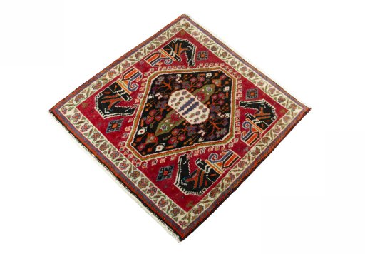 Corner detail of 2000s Shiraz rug showing border pattern and Wool pile