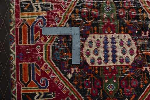 Backside of handmade 2000s Shiraz rug showing knot structure and weave density