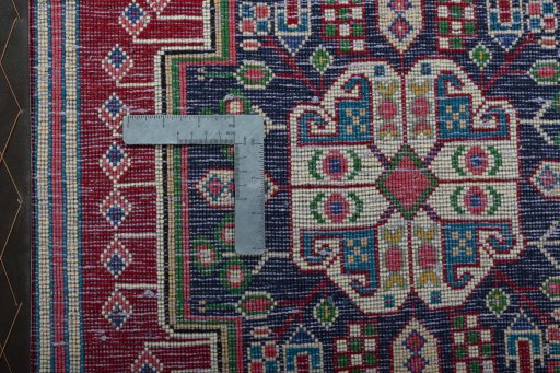 Backside of handmade 2000s Shiraz rug showing knot structure and weave density