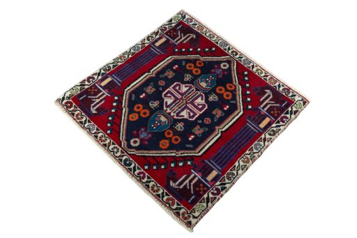 Corner detail of 2000s Shiraz rug showing border pattern and Wool pile