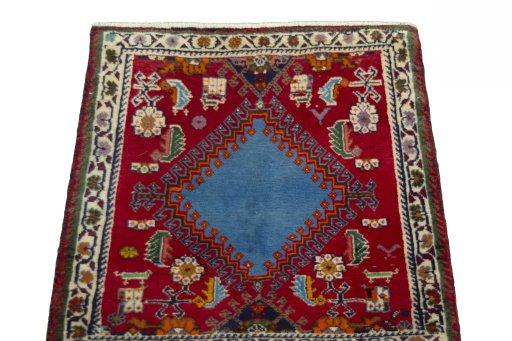Surface texture of 2000s Shiraz rug with natural Wool and intricate pattern