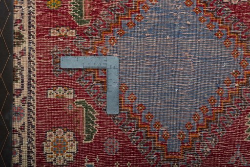 Backside of handmade 2000s Shiraz rug showing knot structure and weave density