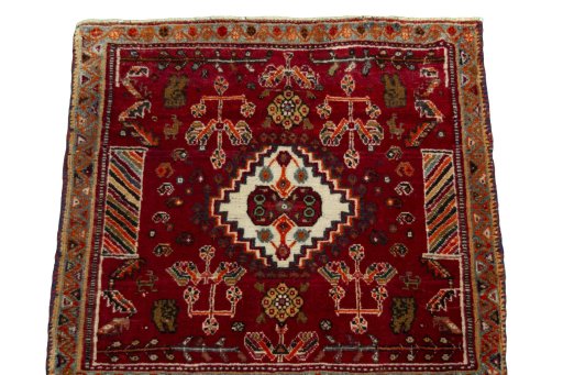 Surface texture of 2000s Shiraz rug with natural Wool and intricate pattern
