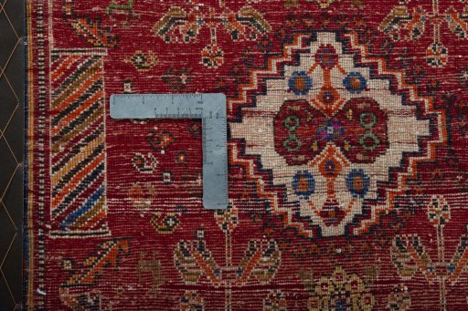 Backside of handmade 2000s Shiraz rug showing knot structure and weave density