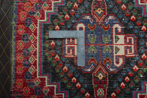 Backside of handmade 2000s Shiraz rug showing knot structure and weave density
