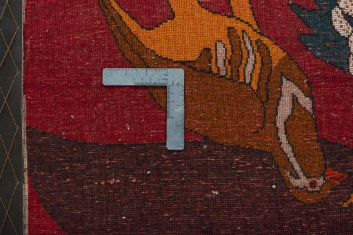 Backside of handmade 2000s Shiraz rug showing knot structure and weave density