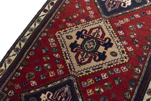 Backside of handmade New Shiraz rug showing knot structure and weave density