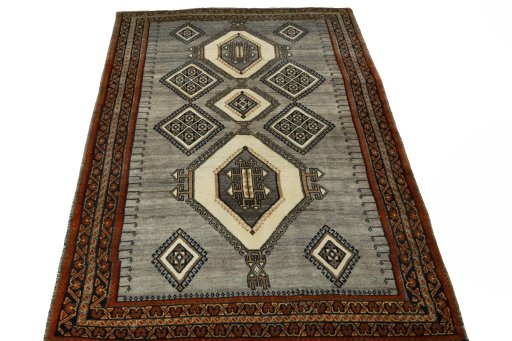 Surface texture of 2000s Shiraz rug with natural Wool and intricate pattern