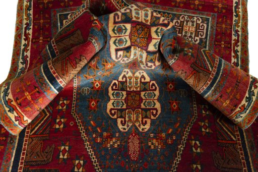 Corner detail of 2000s Shiraz rug showing border pattern and Wool pile