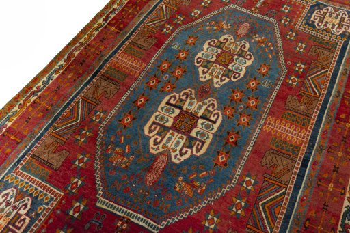 Backside of handmade 2000s Shiraz rug showing knot structure and weave density