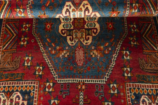 Full view of 2000s Shiraz rug from Iran / Persia, 245 × 148 cm in Red tones