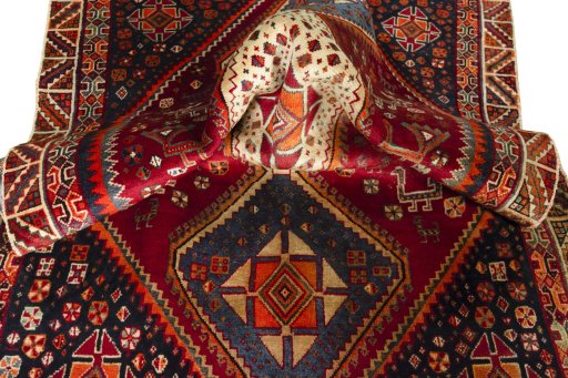 Corner detail of 2000s Shiraz rug showing border pattern and Wool pile
