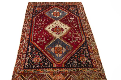 Surface texture of 2000s Shiraz rug with natural Wool and intricate pattern