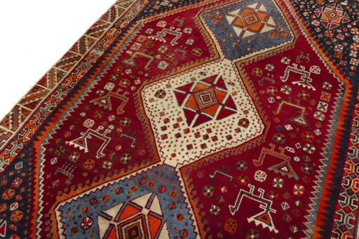 Backside of handmade 2000s Shiraz rug showing knot structure and weave density
