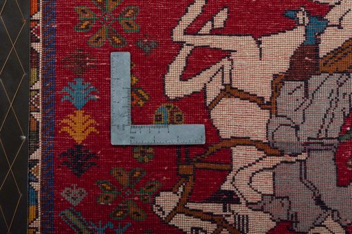 Backside of handmade 2000s Shiraz rug showing knot structure and weave density