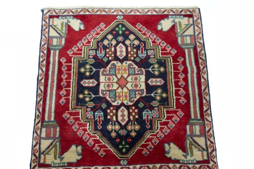 Backside of handmade 2000s Shiraz rug showing knot structure and weave density