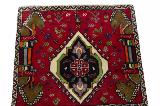 Surface texture of 2000s Shiraz rug with natural Wool and intricate pattern