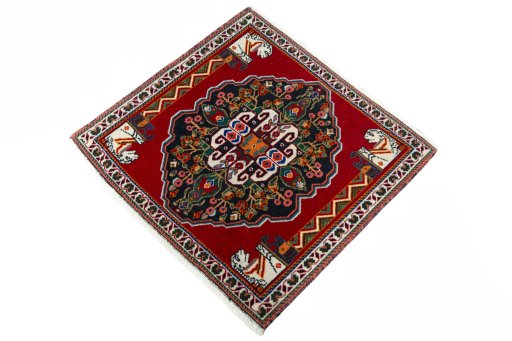 Corner detail of 2000s Shiraz rug showing border pattern and Wool pile