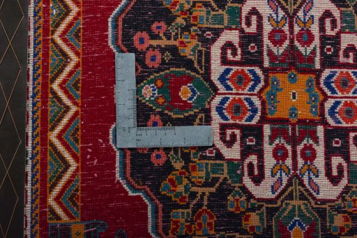 Backside of handmade 2000s Shiraz rug showing knot structure and weave density