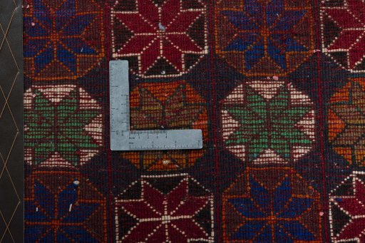 Backside of handmade 2000s Shiraz rug showing knot structure and weave density