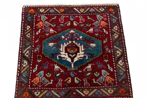 Surface texture of 2000s Shiraz rug with natural Wool and intricate pattern