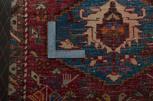 Backside of handmade 2000s Shiraz rug showing knot structure and weave density
