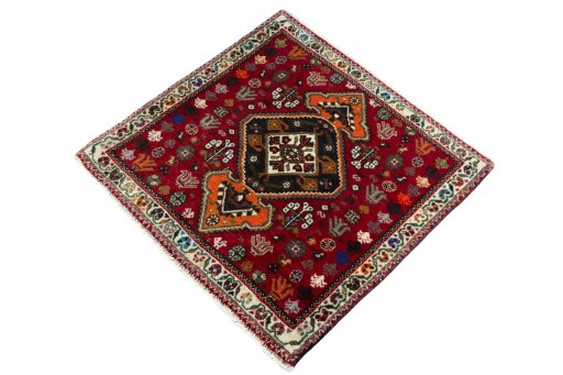 Corner detail of 2000s Shiraz rug showing border pattern and Wool pile