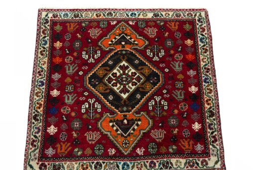 Surface texture of 2000s Shiraz rug with natural Wool and intricate pattern