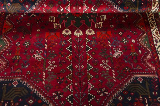 Corner detail of 2000s Shiraz rug showing border pattern and Wool pile