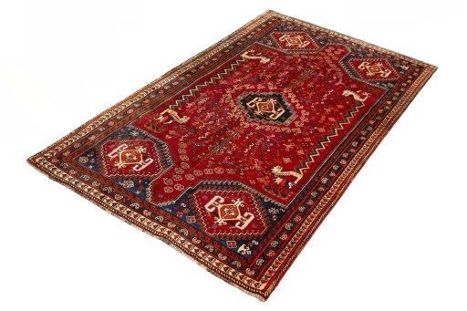 Corner detail of 2000s Shiraz rug showing border pattern and Wool pile