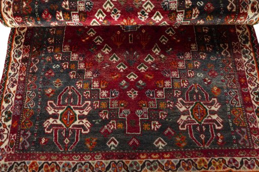 Corner detail of 2000s Shiraz rug showing border pattern and Wool pile
