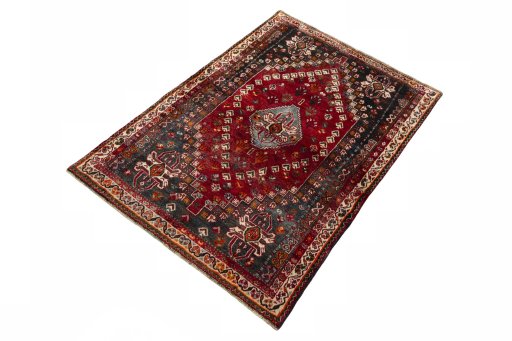 Corner detail of 2000s Shiraz rug showing border pattern and Wool pile