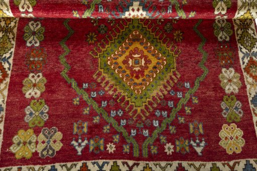 Corner detail of 2000s Shiraz rug showing border pattern and Wool pile