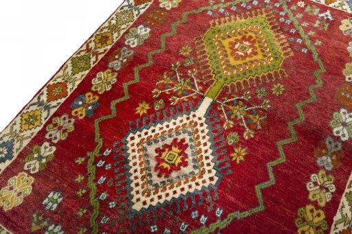 Backside of handmade 2000s Shiraz rug showing knot structure and weave density