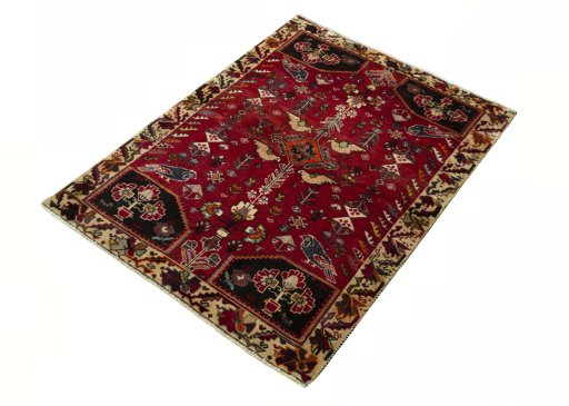 Corner detail of 2000s Shiraz rug showing border pattern and Wool pile