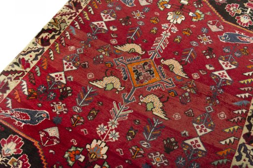 Backside of handmade 2000s Shiraz rug showing knot structure and weave density