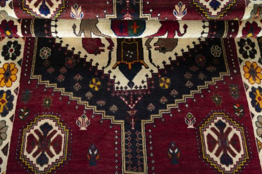 Corner detail of 2000s Shiraz rug showing border pattern and Wool pile