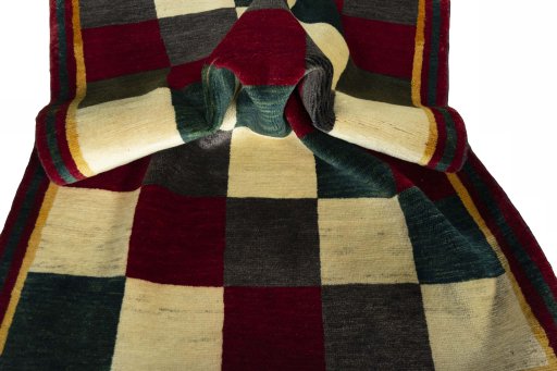 Corner detail of 2000s Shiraz rug showing border pattern and Wool pile