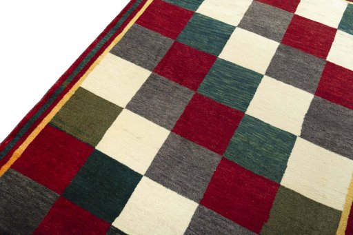 Backside of handmade 2000s Shiraz rug showing knot structure and weave density