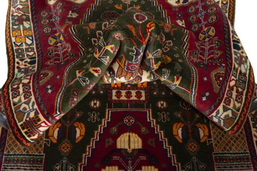 Corner detail of 2000s Shiraz rug showing border pattern and Wool pile