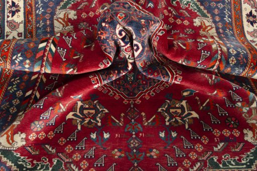 Surface texture of 1970s Shiraz rug with natural Wool and intricate pattern